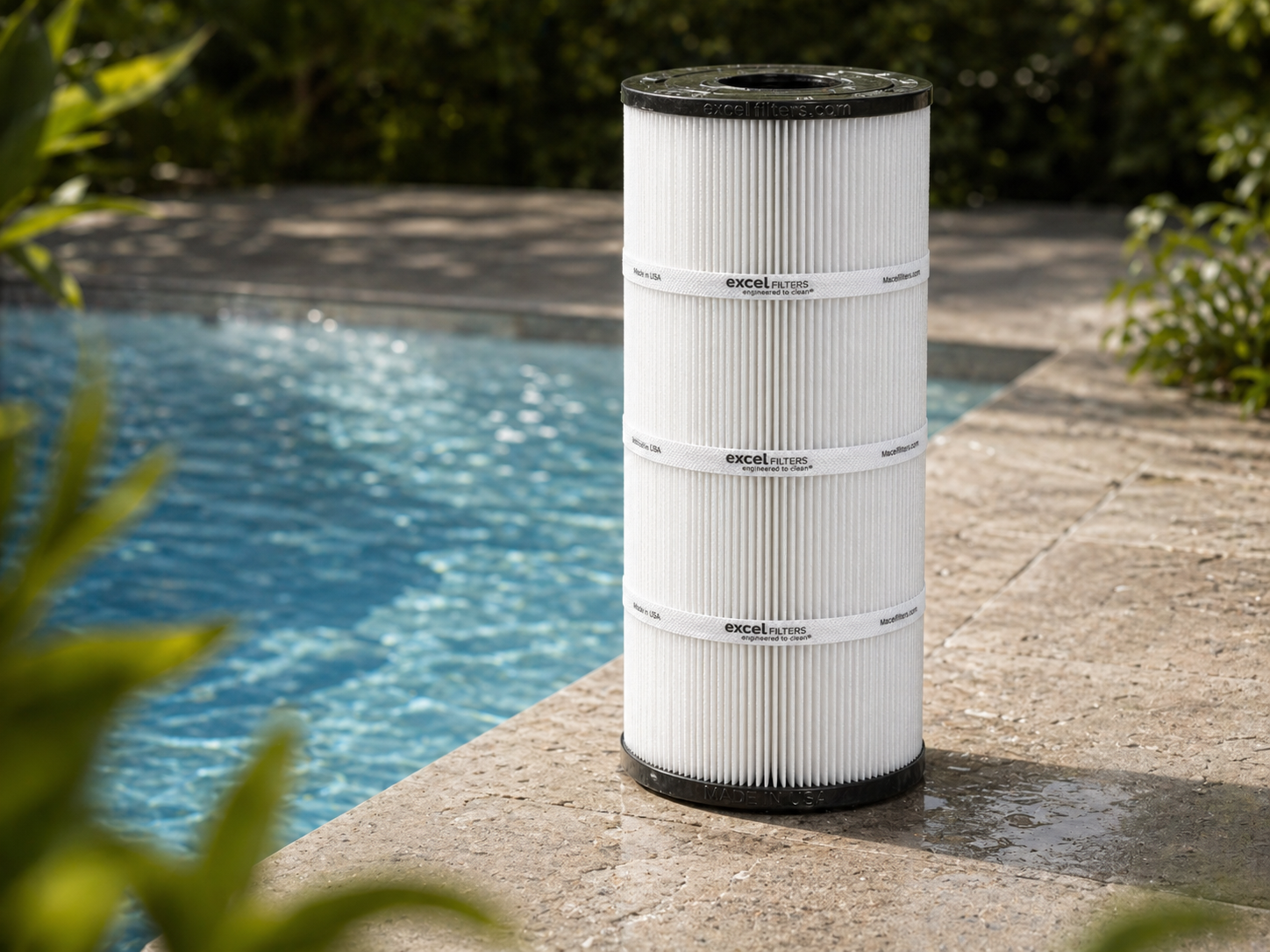 Excel replacement pool filter cartridge beside a pool