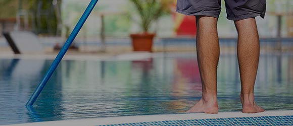 Pool professional servicing a cartridge filter